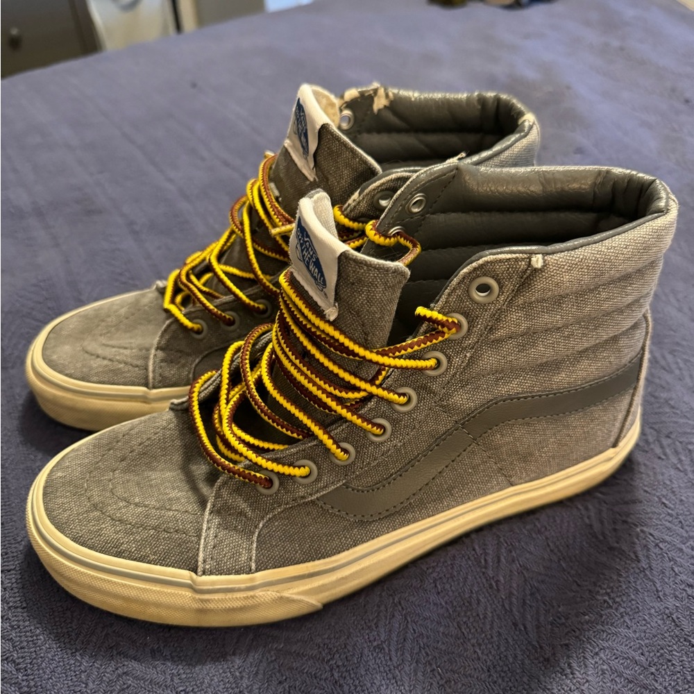 High top Vans. Used but with a vintage appeal. Men’s size 7, women’s 8.5.